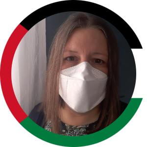 photo of a white woman in a white KF94 facemask. The colors of Sudan's and Palestine's flags circle the image